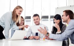 Group of business people working with digital tablet in office